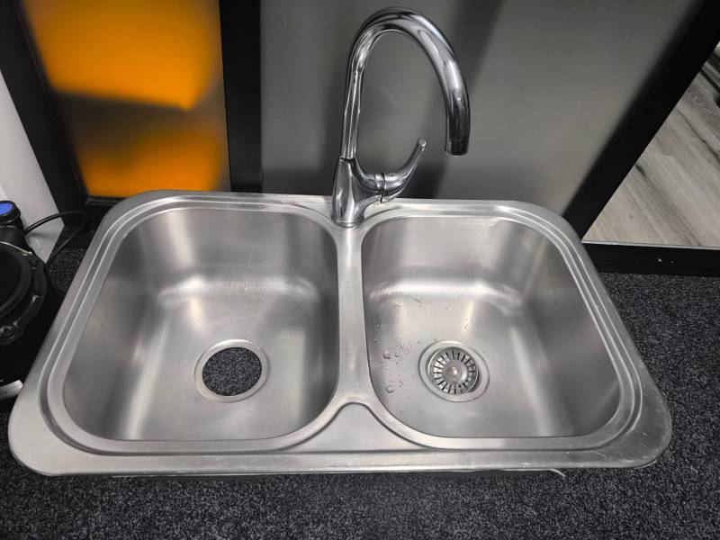 Kitchen sink , tape and waste disposal unit